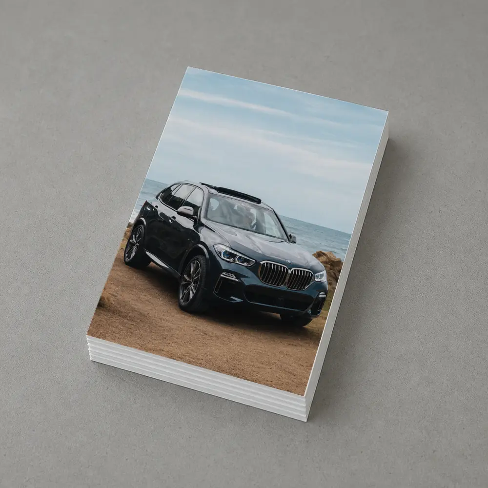 BMW X3 Parked on Coastal Cliff Trail – Postcards