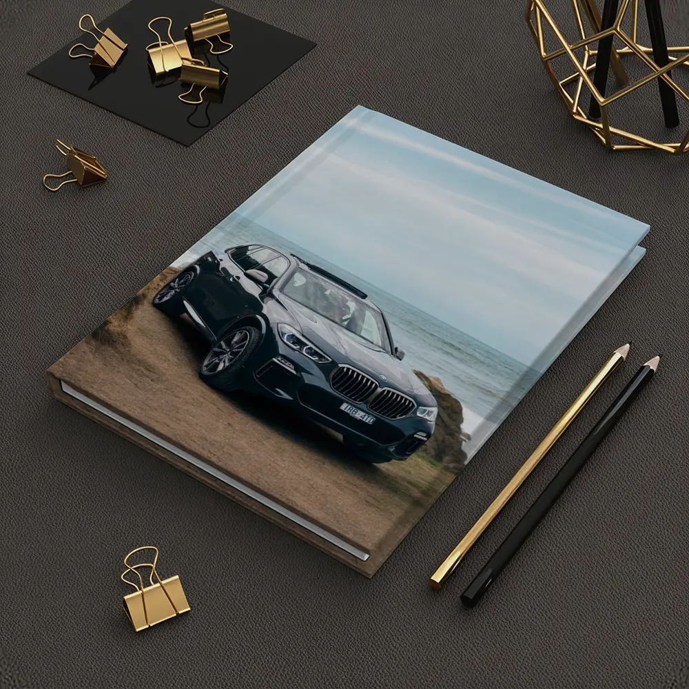 BMW X5 Parked by Coastal Rocky Shore – Notebooks