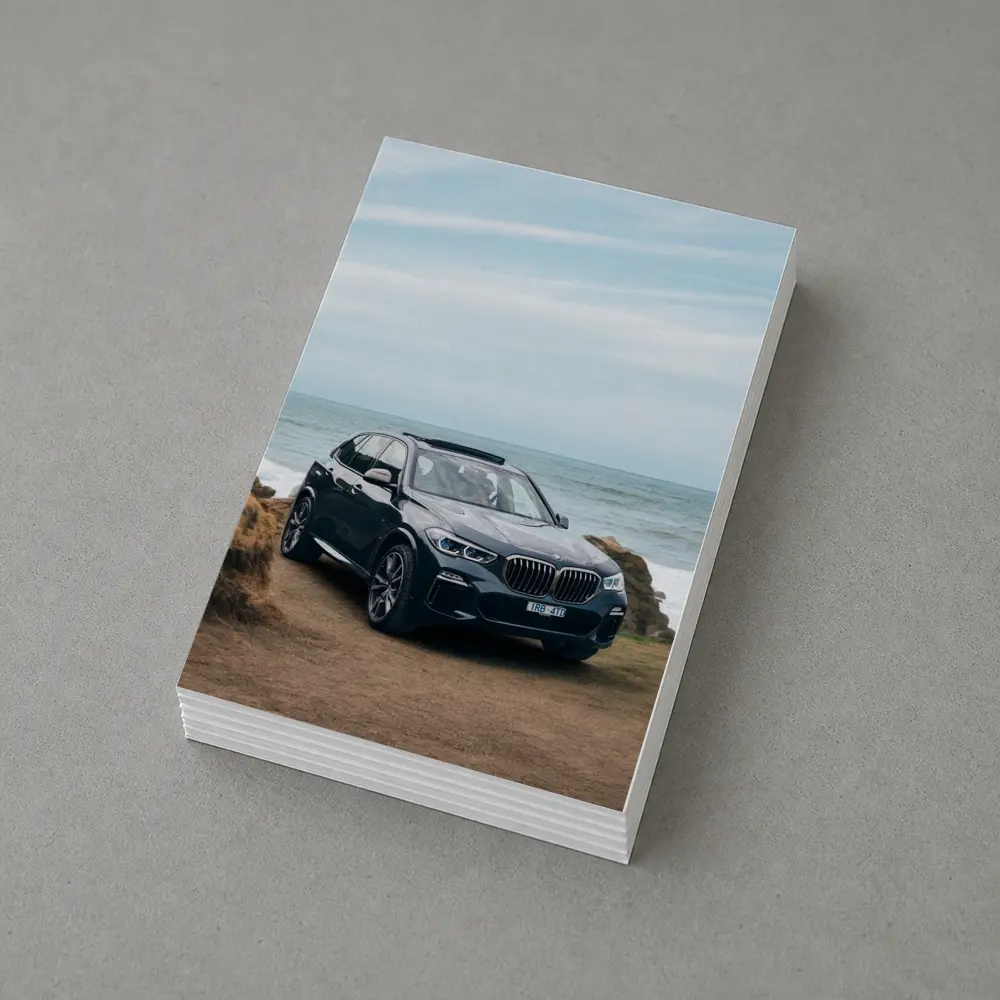 BMW X5 Parked by Coastal Rocky Shore – Postcards