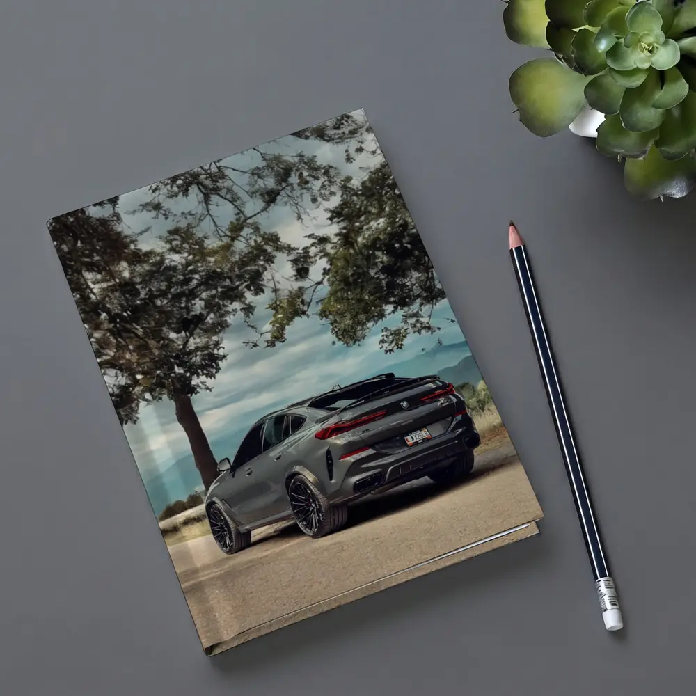 BMW X6M Matte Gray Mountain Road Scene – Notebooks