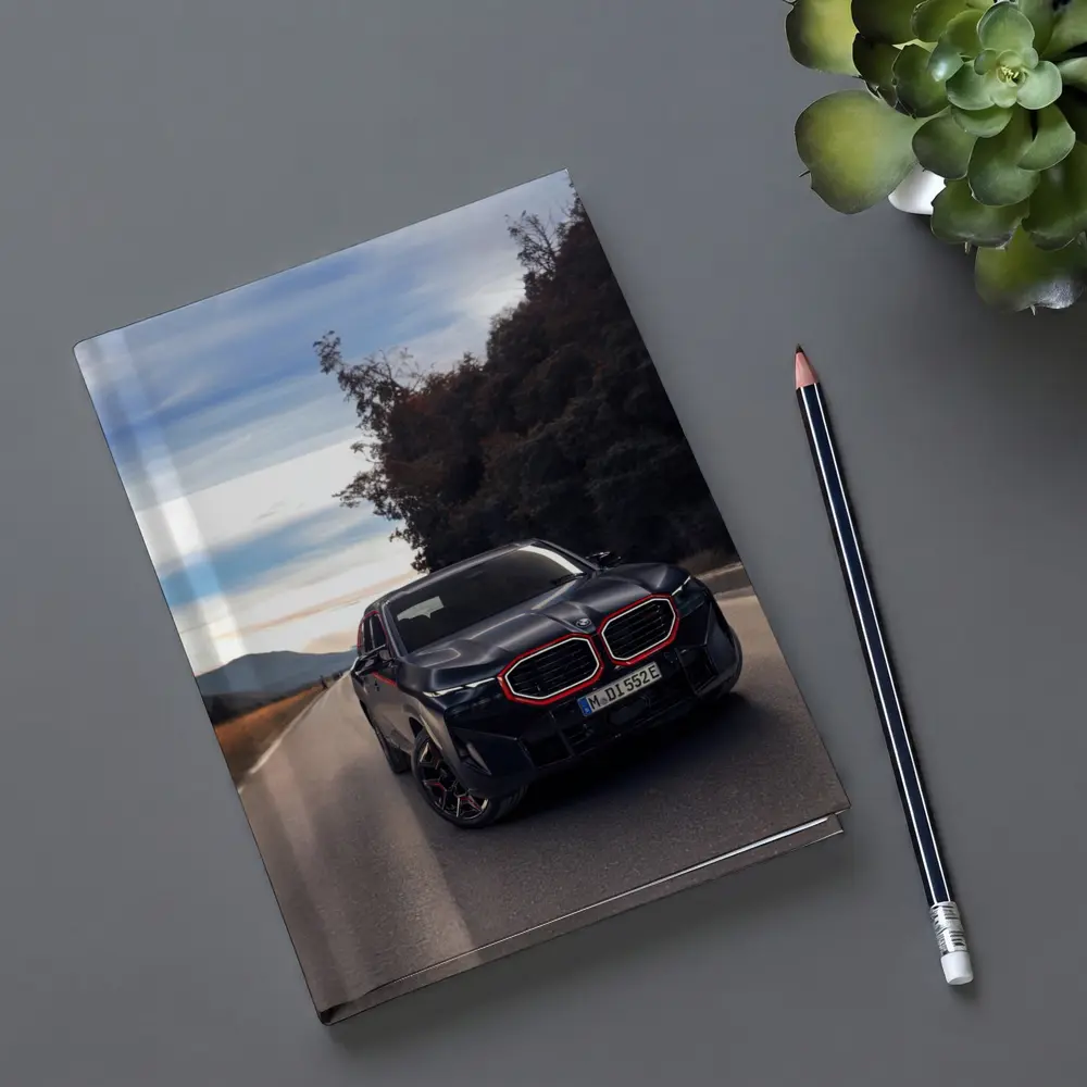 BMW XM Label Red on Open Road – Notebooks