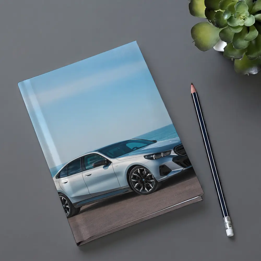 BMW i5 Silver Sedan By The Ocean – Notebooks