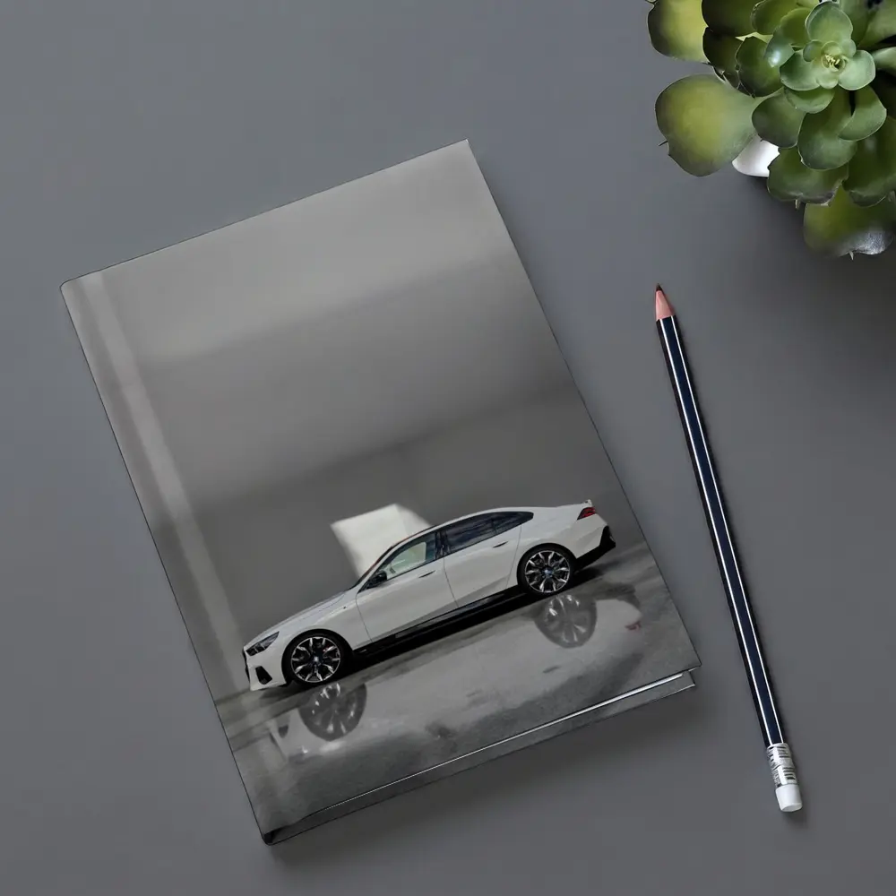 BMW i5 Sedan White Minimalist Concrete Setting – Notebooks