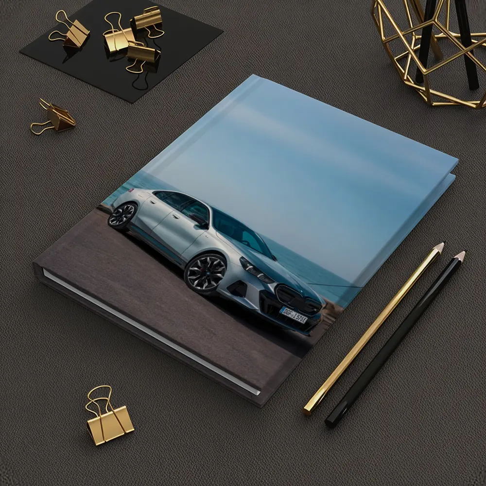 BMW i5 Sedan Parked by the Ocean – Notebooks