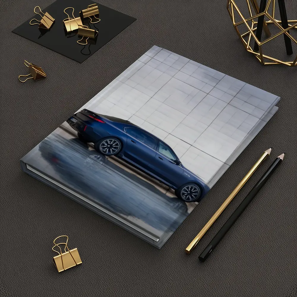 BMW i7 Blue Sedan Against Silver Wall – Notebooks