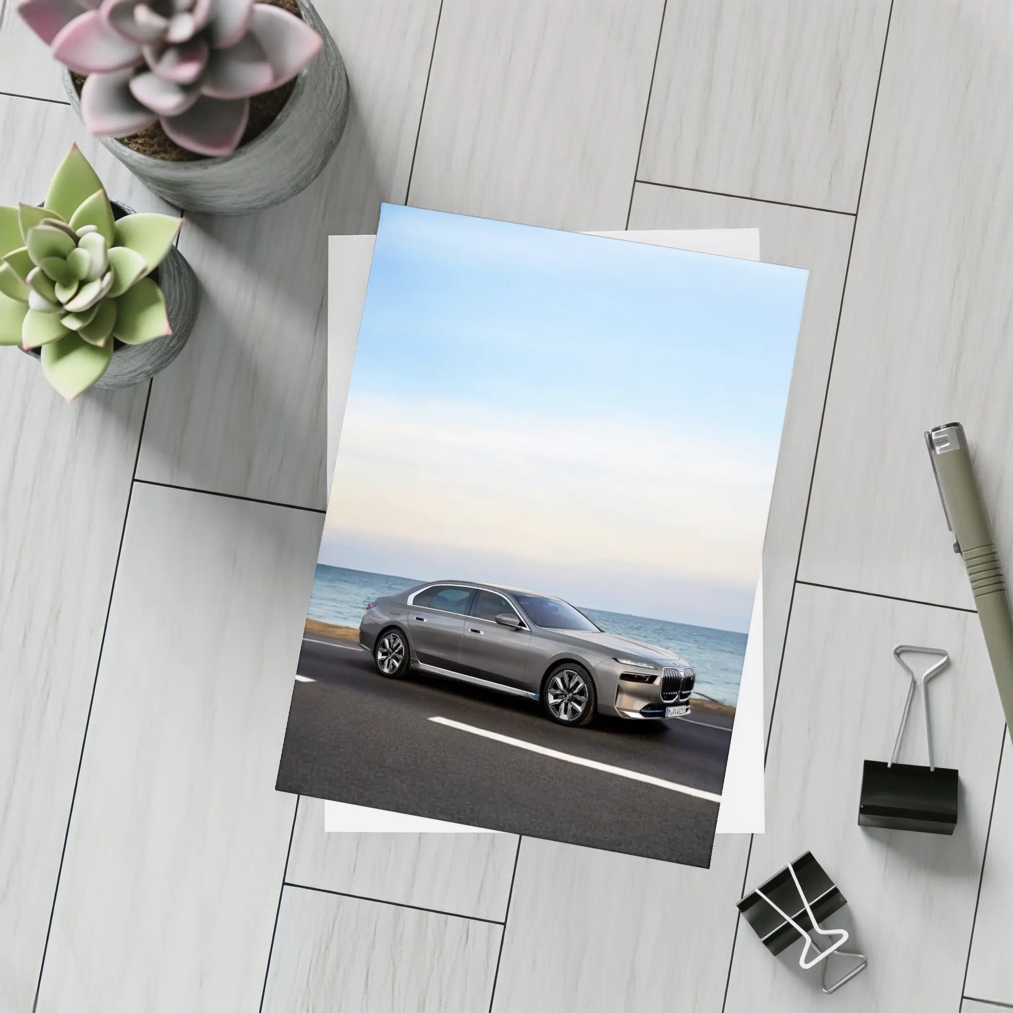 BMW i7 Gray Sedan by the Ocean – Postcards