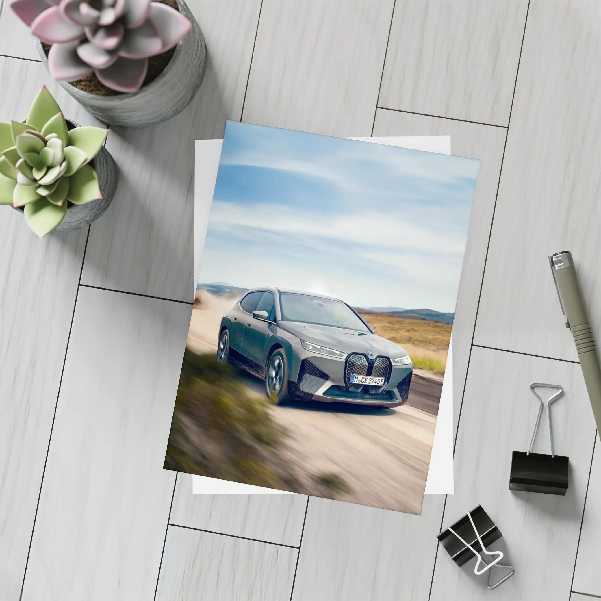 BMW iX Driving Dusty Desert Road – Postcards
