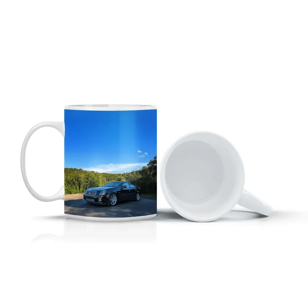 Black Cadillac CTS Parked Against Blue Sky – Mugs