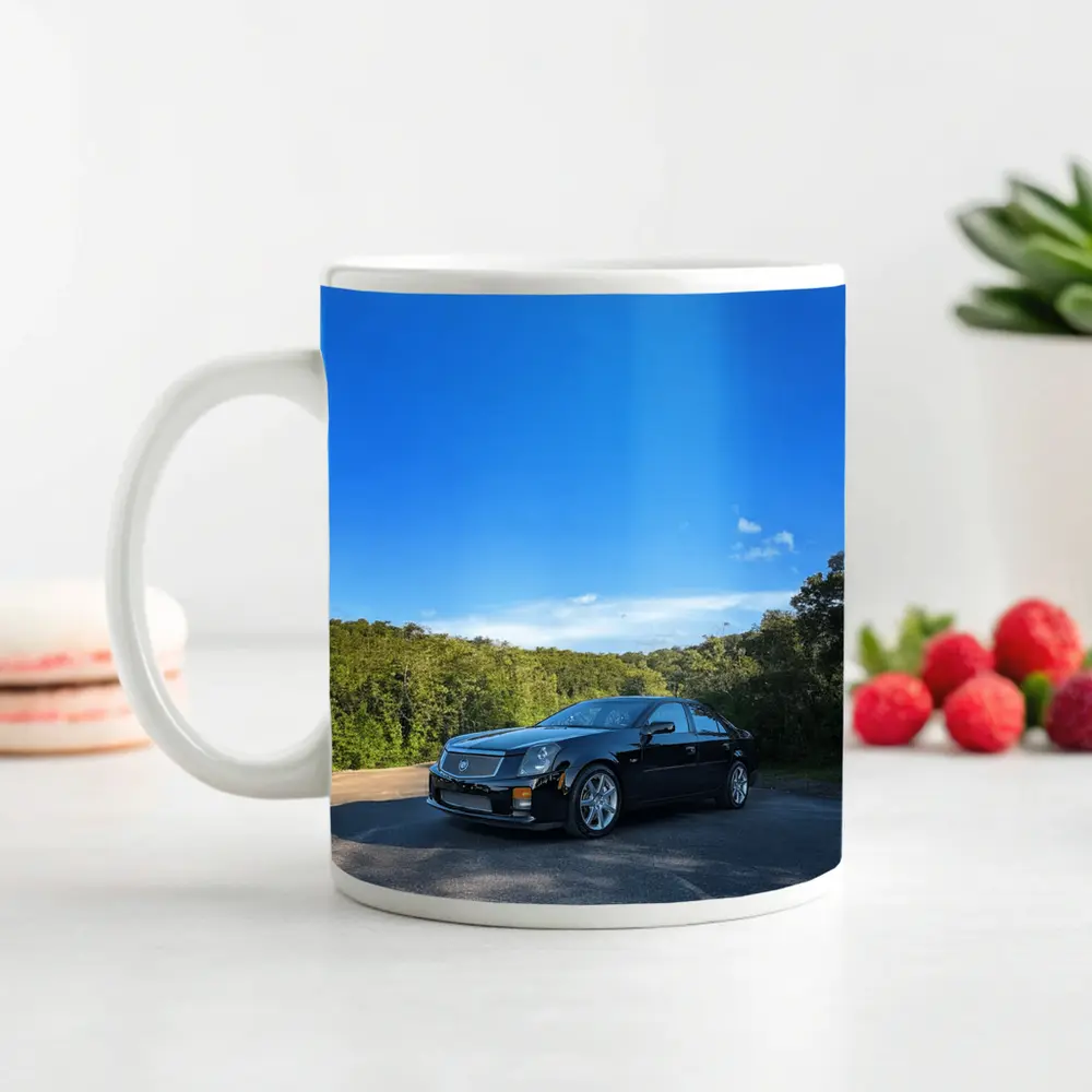 Black Cadillac CTS Parked Against Blue Sky – Mugs