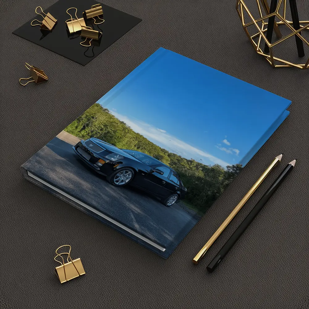 Black Cadillac CTS Parked Against Blue Sky – Notebooks