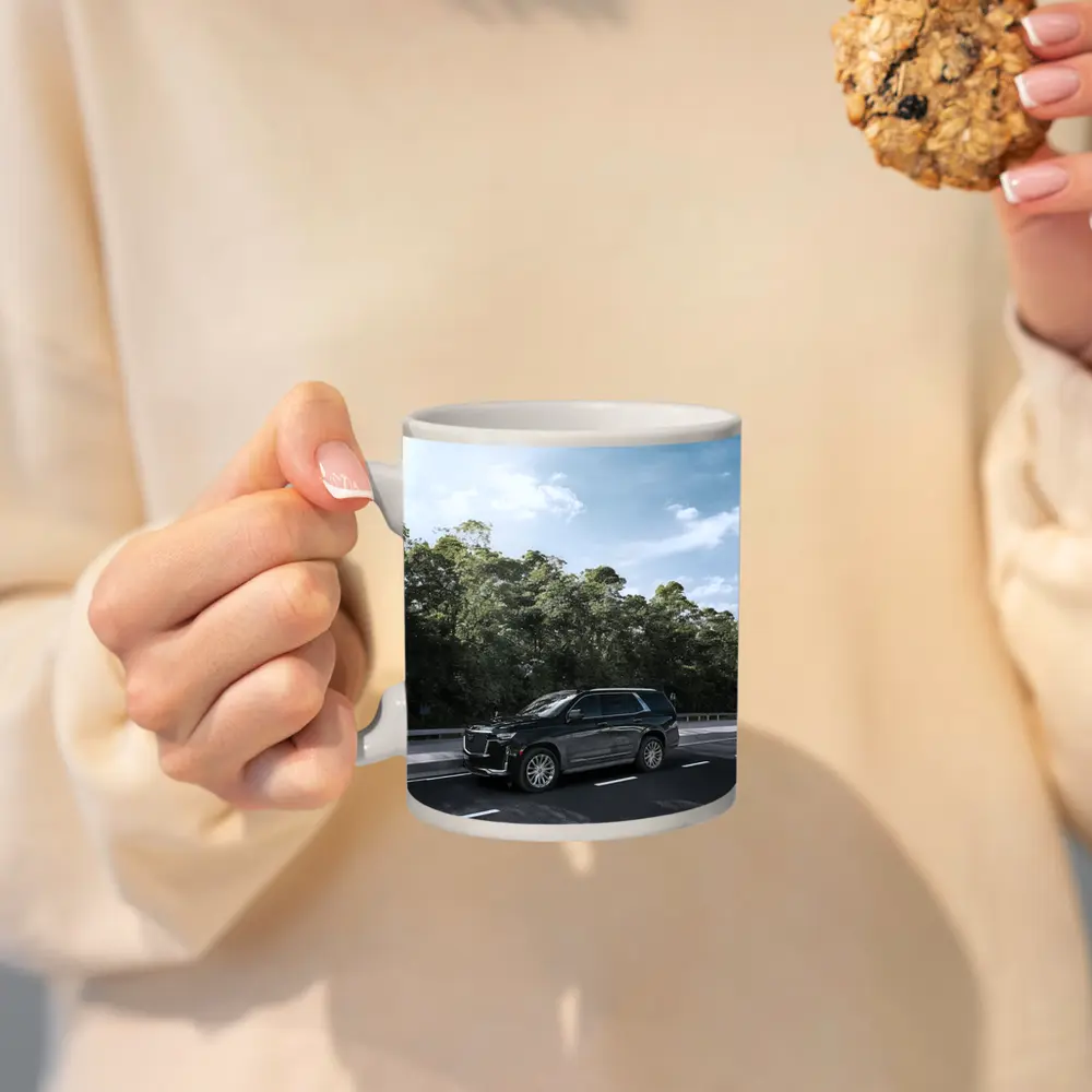 Black Cadillac Escalade SUV On Highway – Mugs