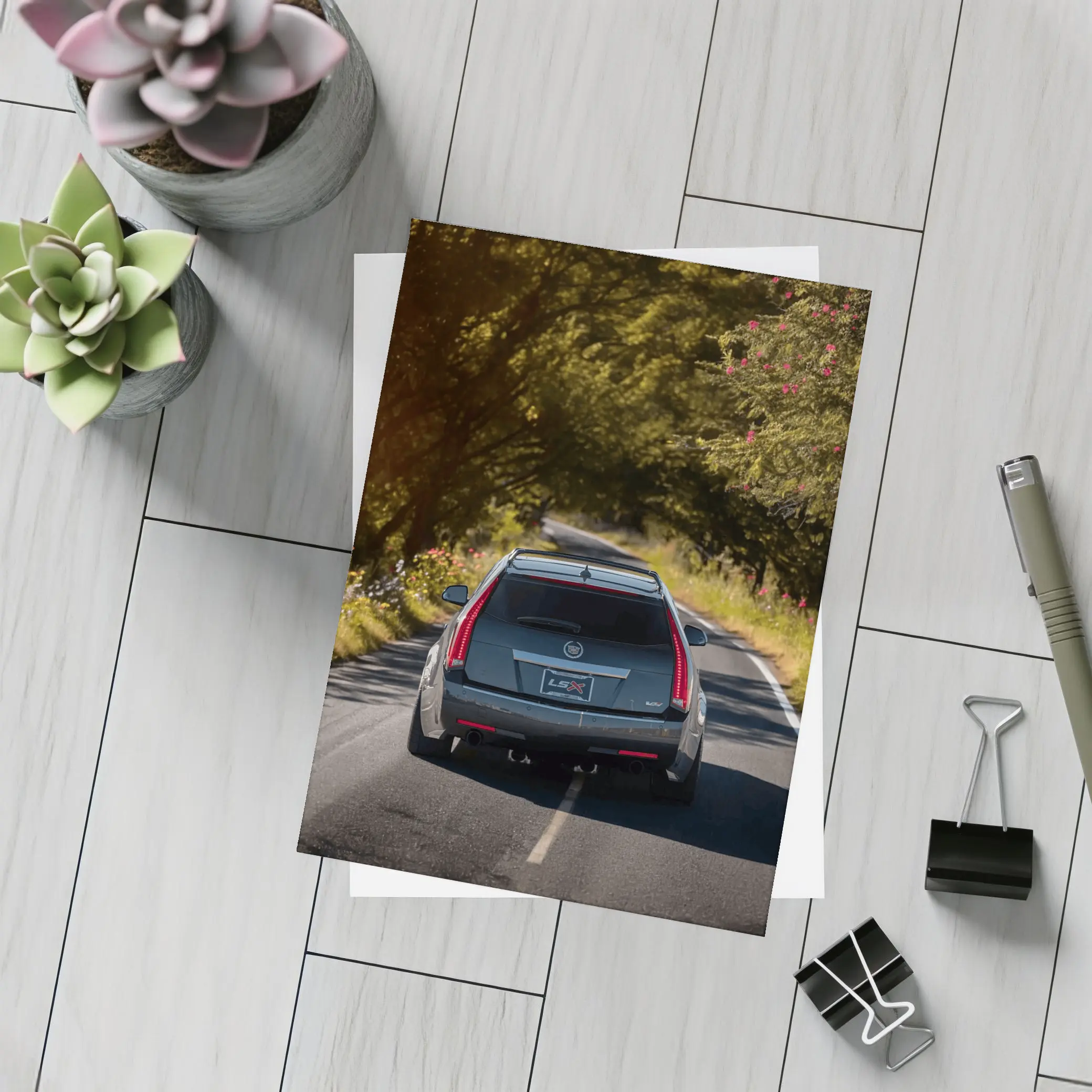 Cadillac CTS Wagon Driving Through Forest Road – Postcards