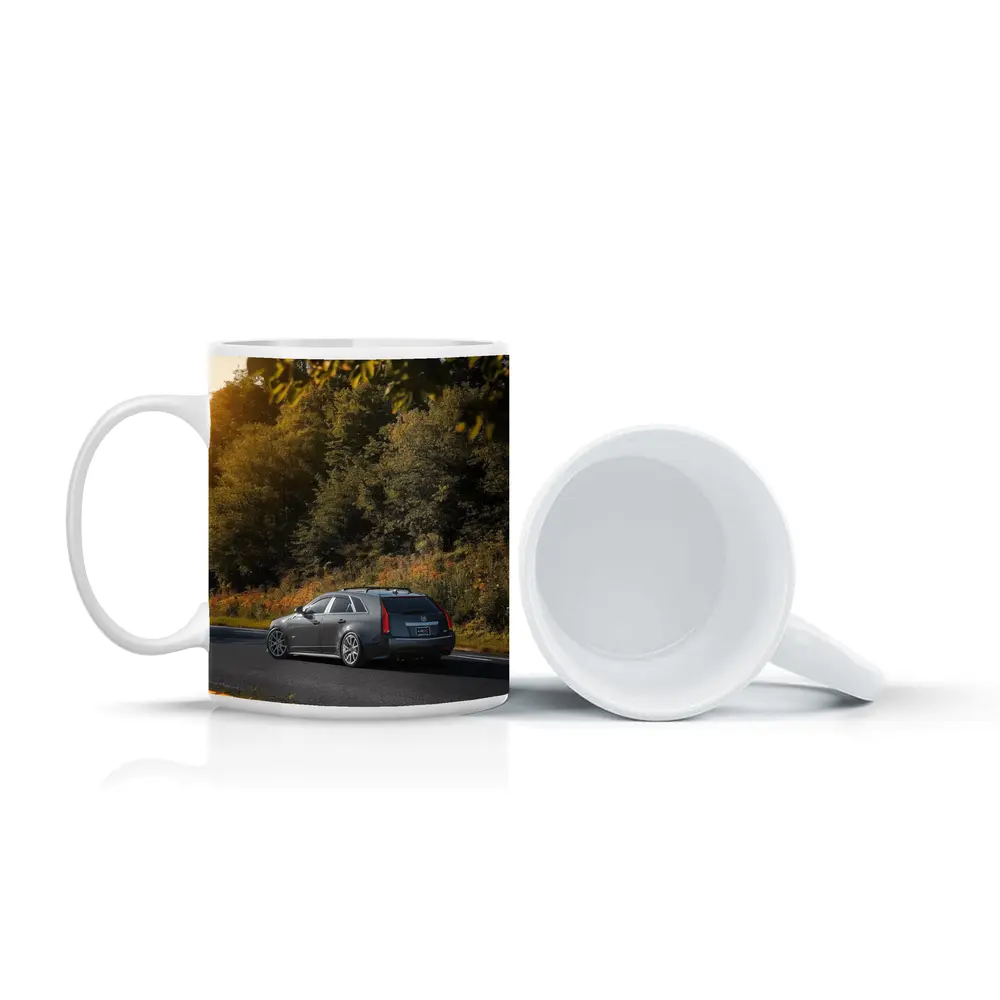 Cadillac CTS Wagon Rolling Through Forest Road – Mugs