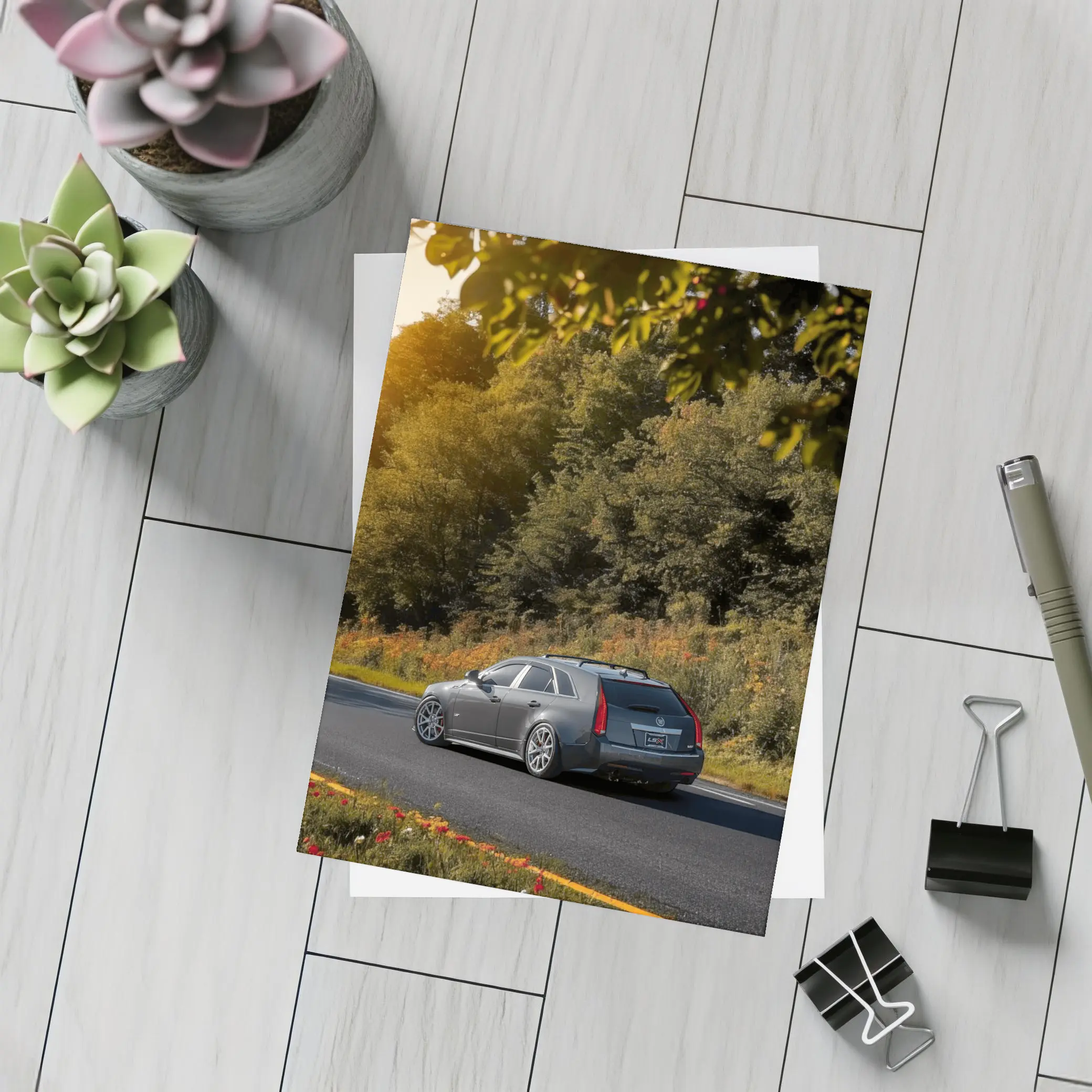 Cadillac CTS Wagon Rolling Through Forest Road – Postcards