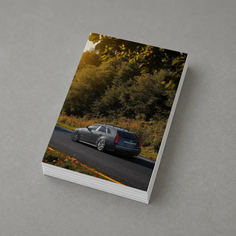 Cadillac CTS Wagon Rolling Through Forest Road – Postcards