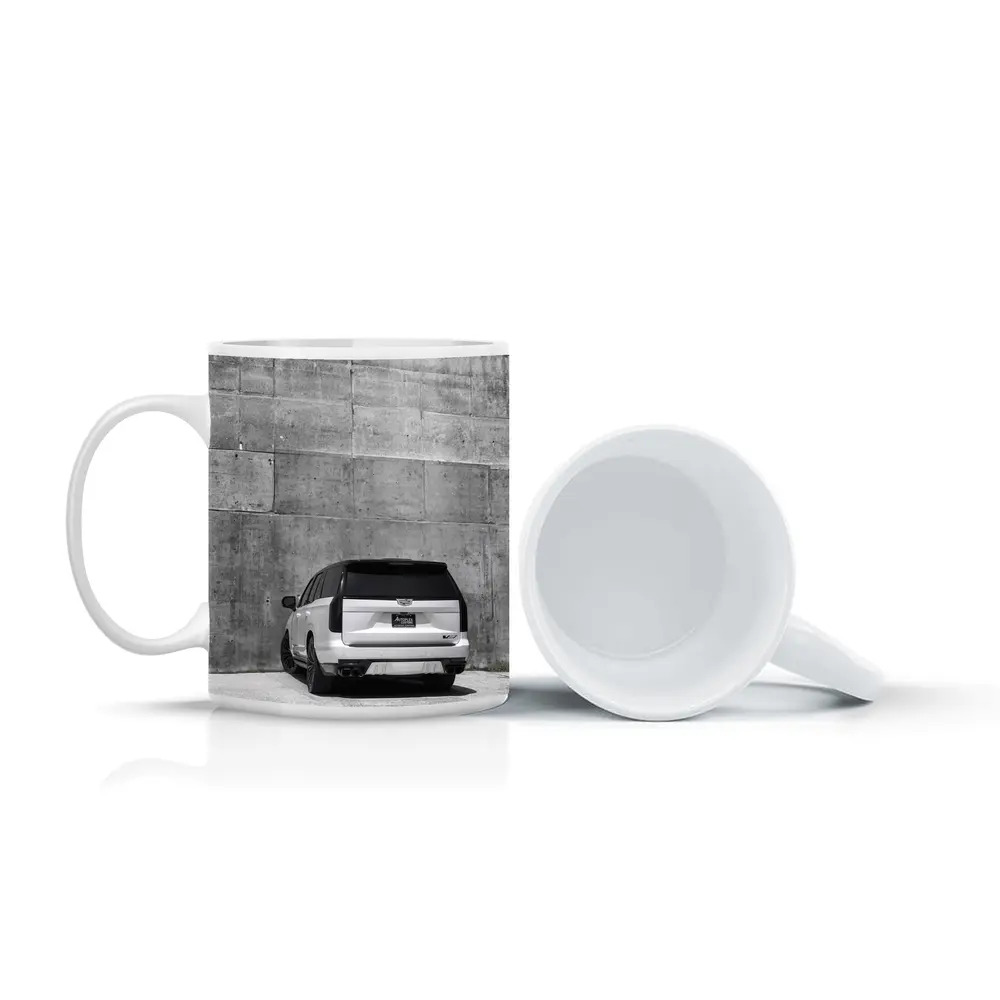 White Cadillac Escalade Against Concrete Wall – Mugs