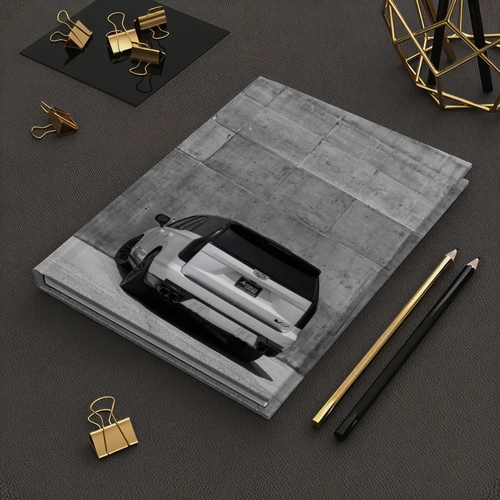 White Cadillac Escalade Against Concrete Wall – Notebooks