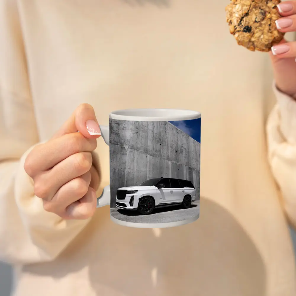 Cadillac Escalade White Against Concrete Wall – Mugs