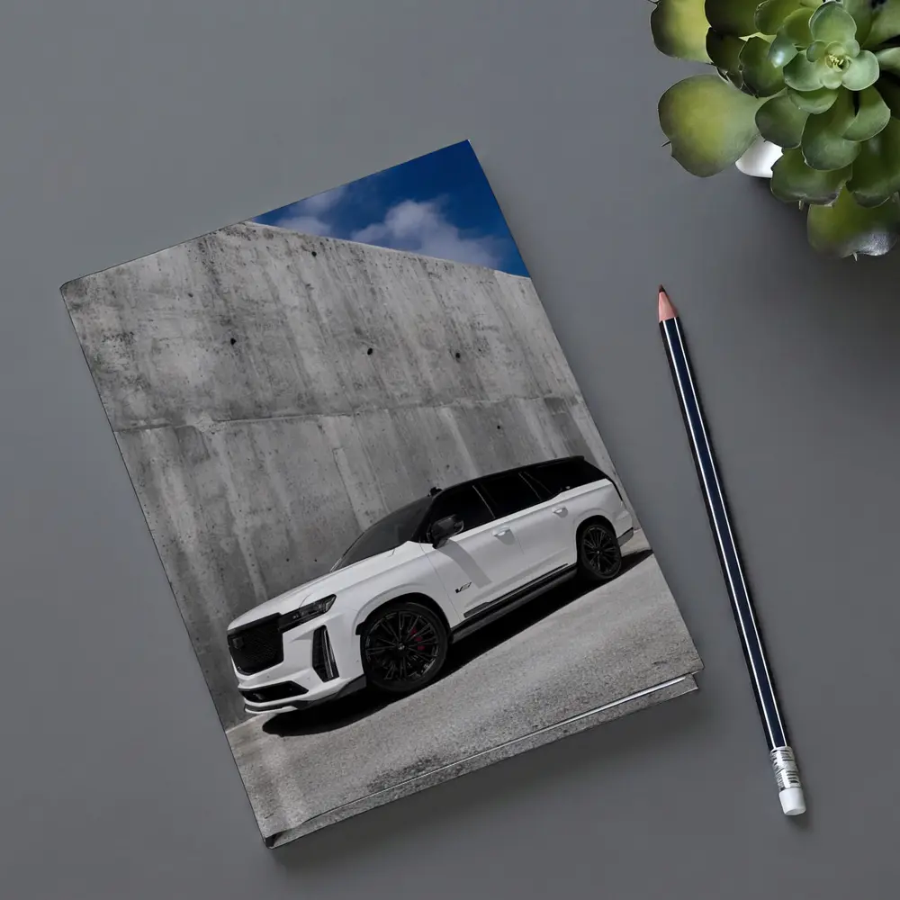 Cadillac Escalade White Against Concrete Wall – Notebooks