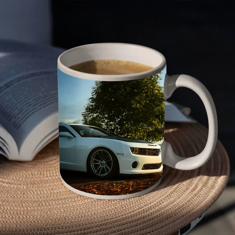 White Chevrolet Camaro Parked Near Green Tree – Mugs