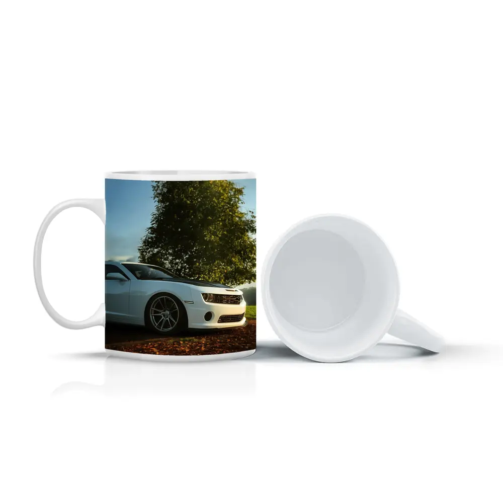 White Chevrolet Camaro Parked Near Green Tree – Mugs