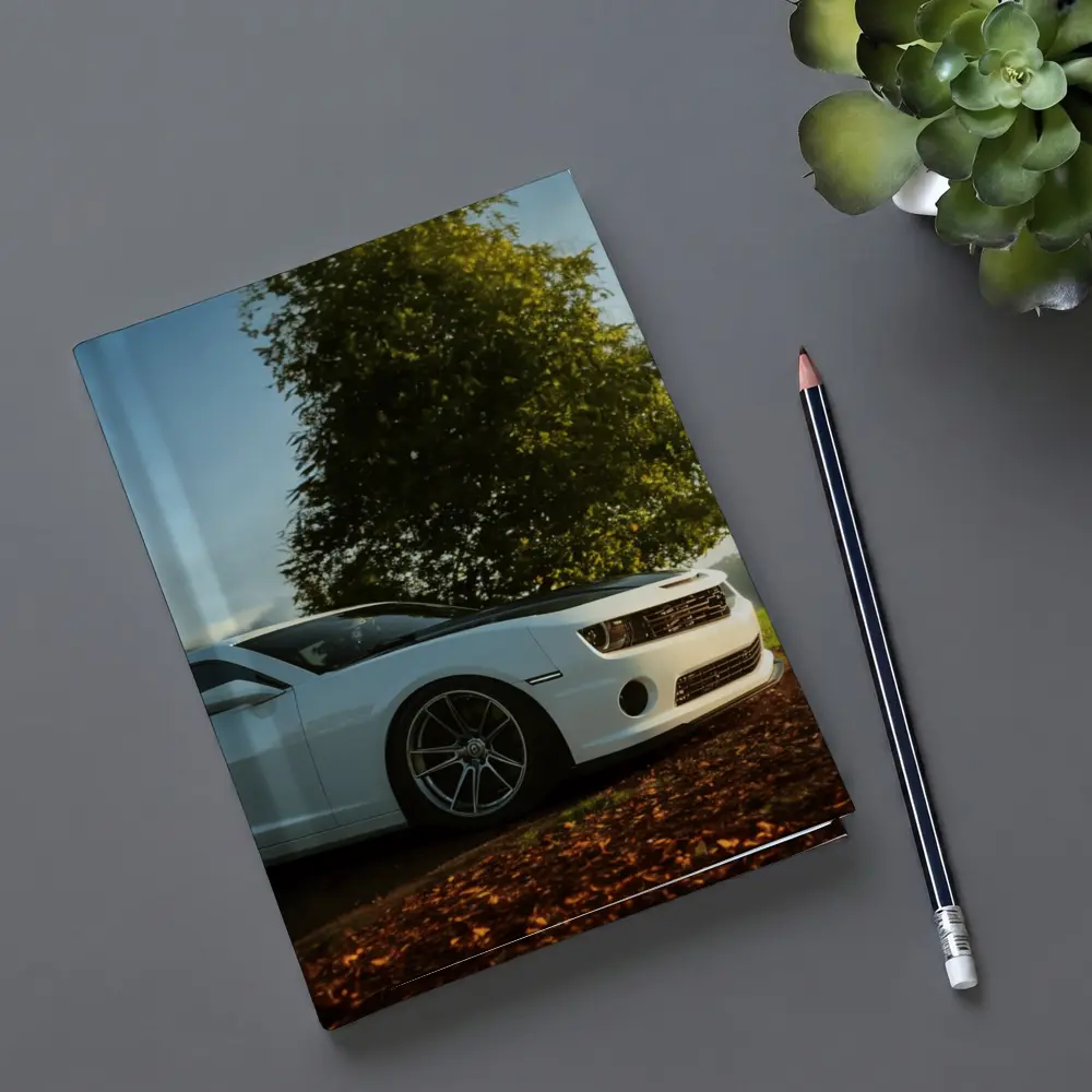 White Chevrolet Camaro Parked Near Green Tree – Notebooks