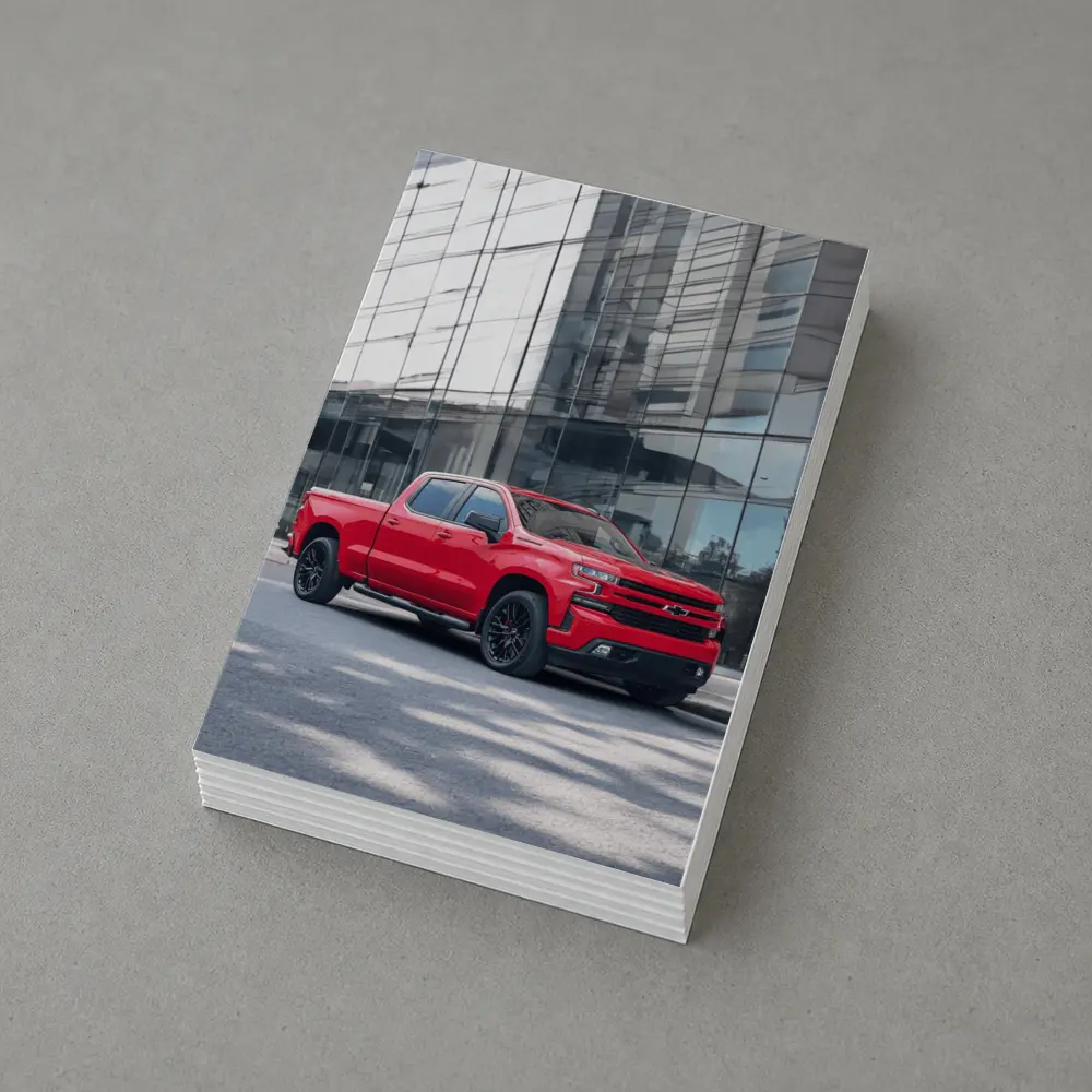 Red Chevrolet Silverado Parked by Glass Building – Postcards
