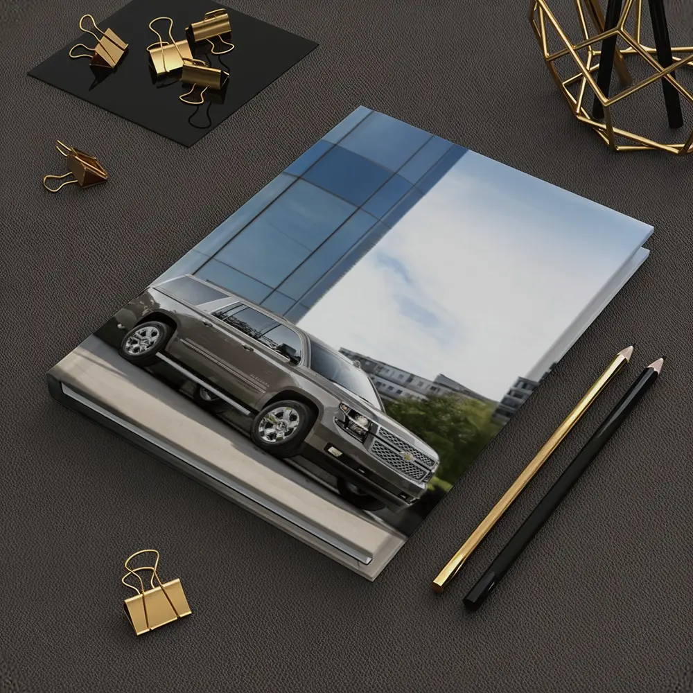 Chevrolet Suburban Parked Outside Glass Building – Notebooks