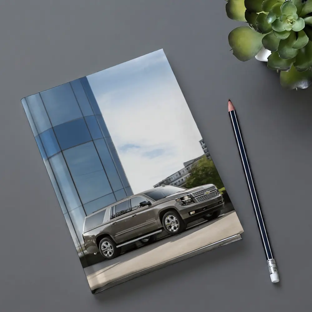 Chevrolet Suburban Parked Outside Glass Building – Notebooks