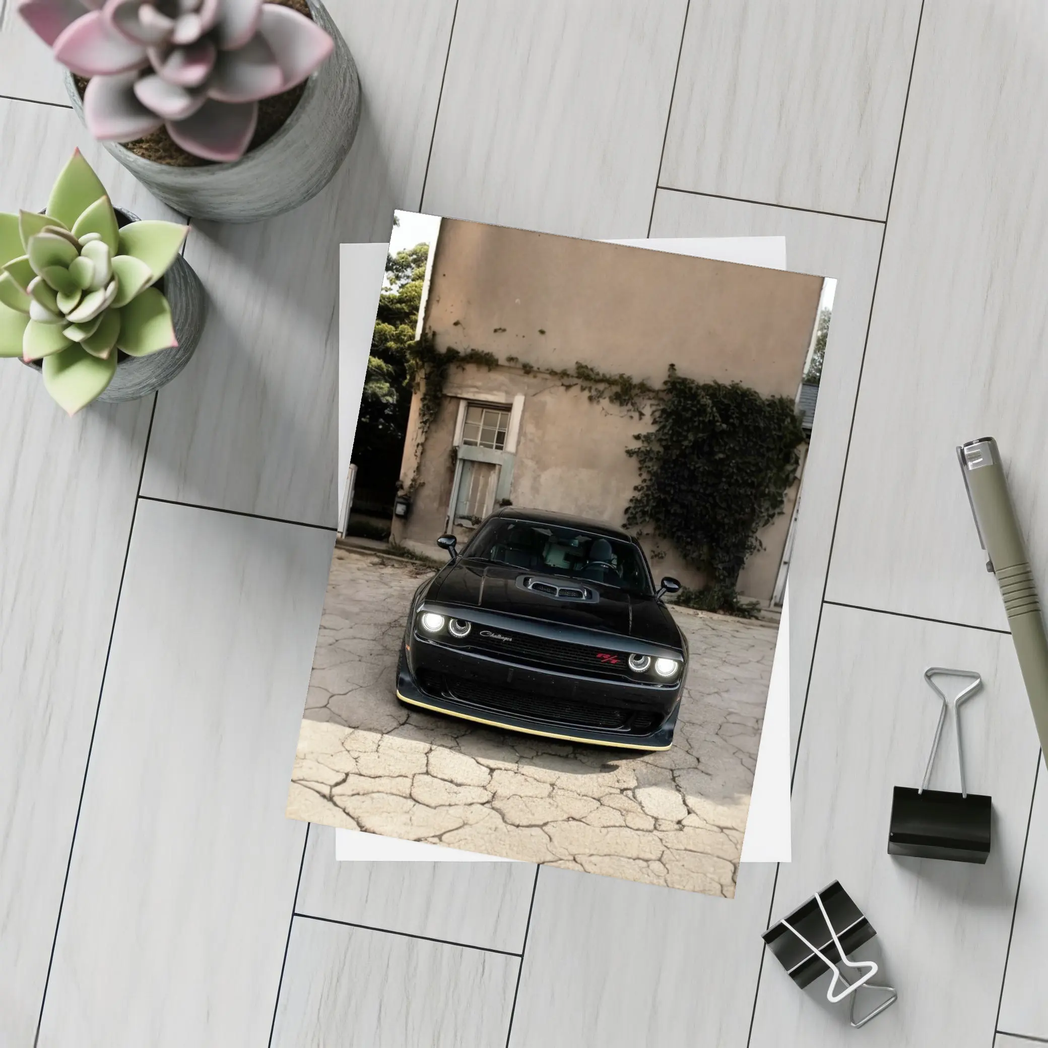 Black Dodge Challenger Parked Before Old House – Postcards