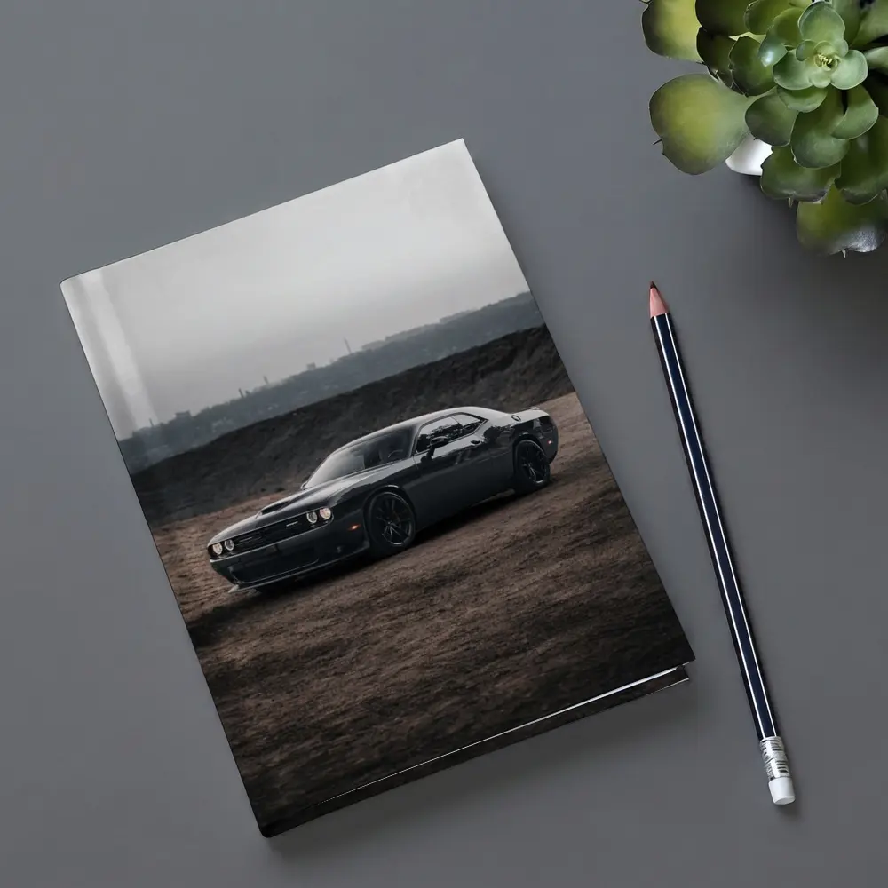 Black Dodge Challenger Parked on Dirt Ground – Notebooks
