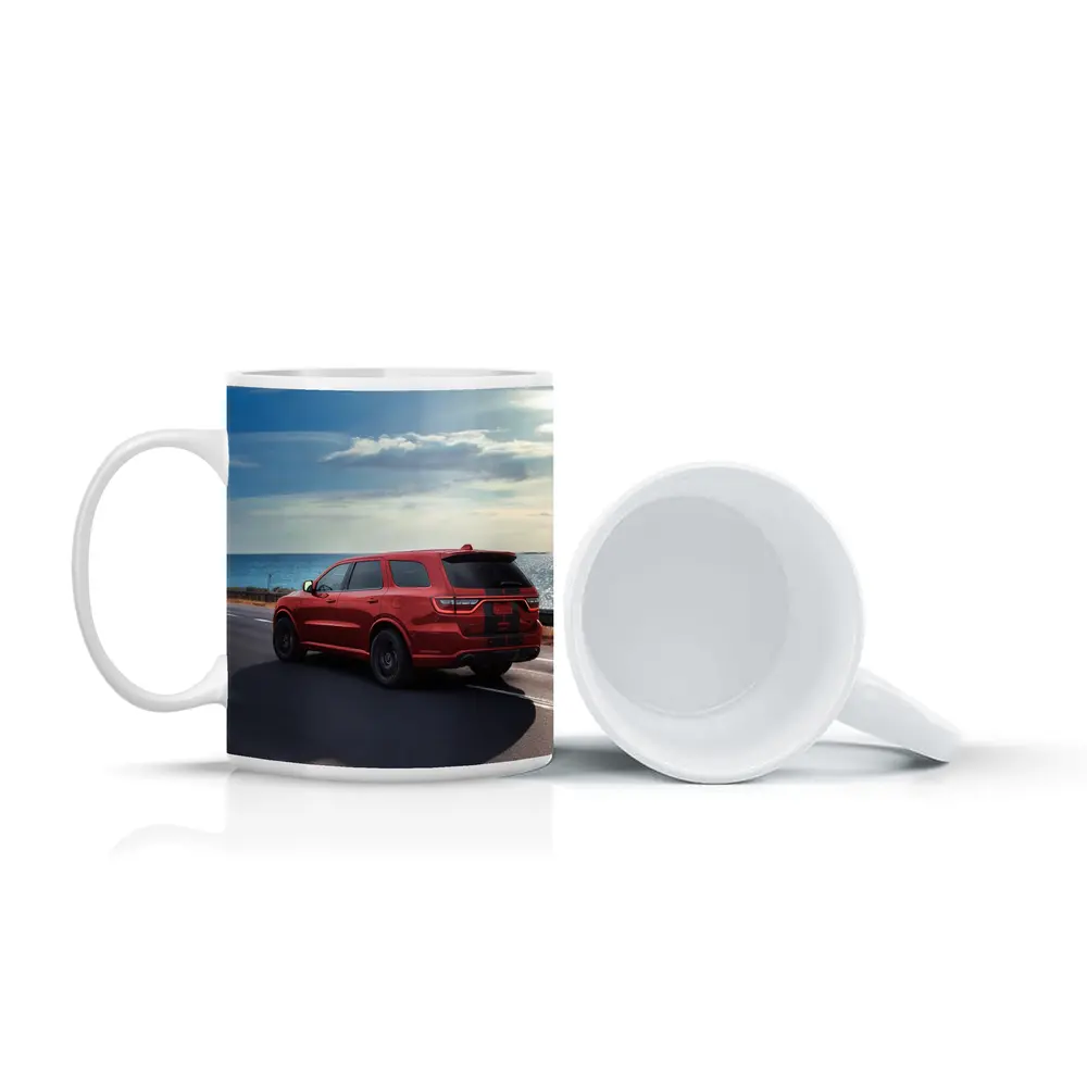Red Dodge Durango Driving Along Coastal Road – Mugs