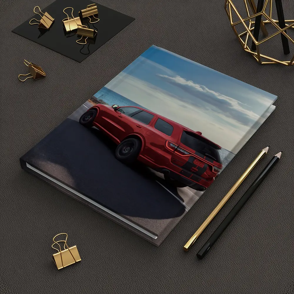 Red Dodge Durango Driving Along Coastal Road – Notebooks