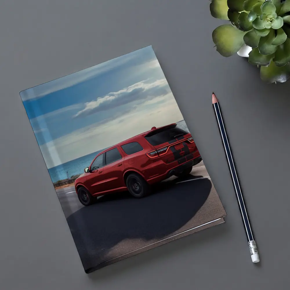 Red Dodge Durango Driving Along Coastal Road – Notebooks