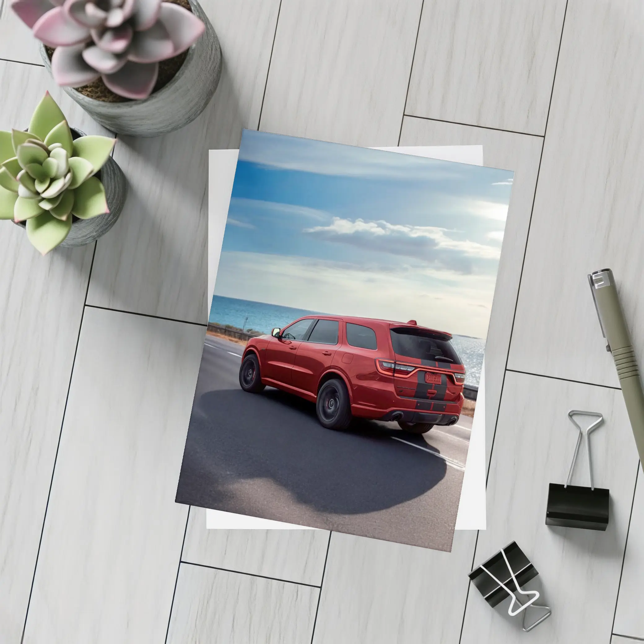 Red Dodge Durango Driving Along Coastal Road – Postcards