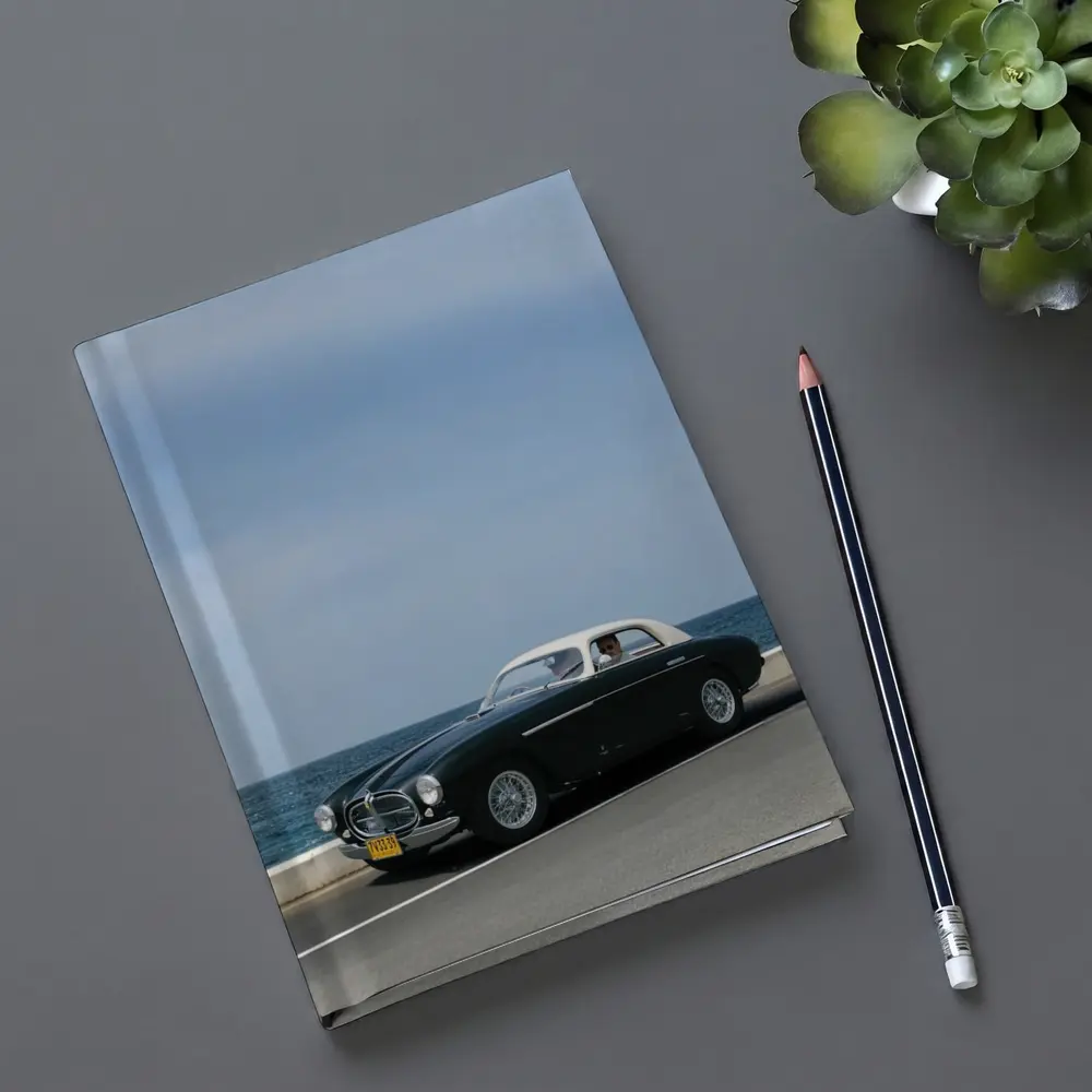 Classic Ferrari Coupe Driving Along Coastal Road – Notebooks
