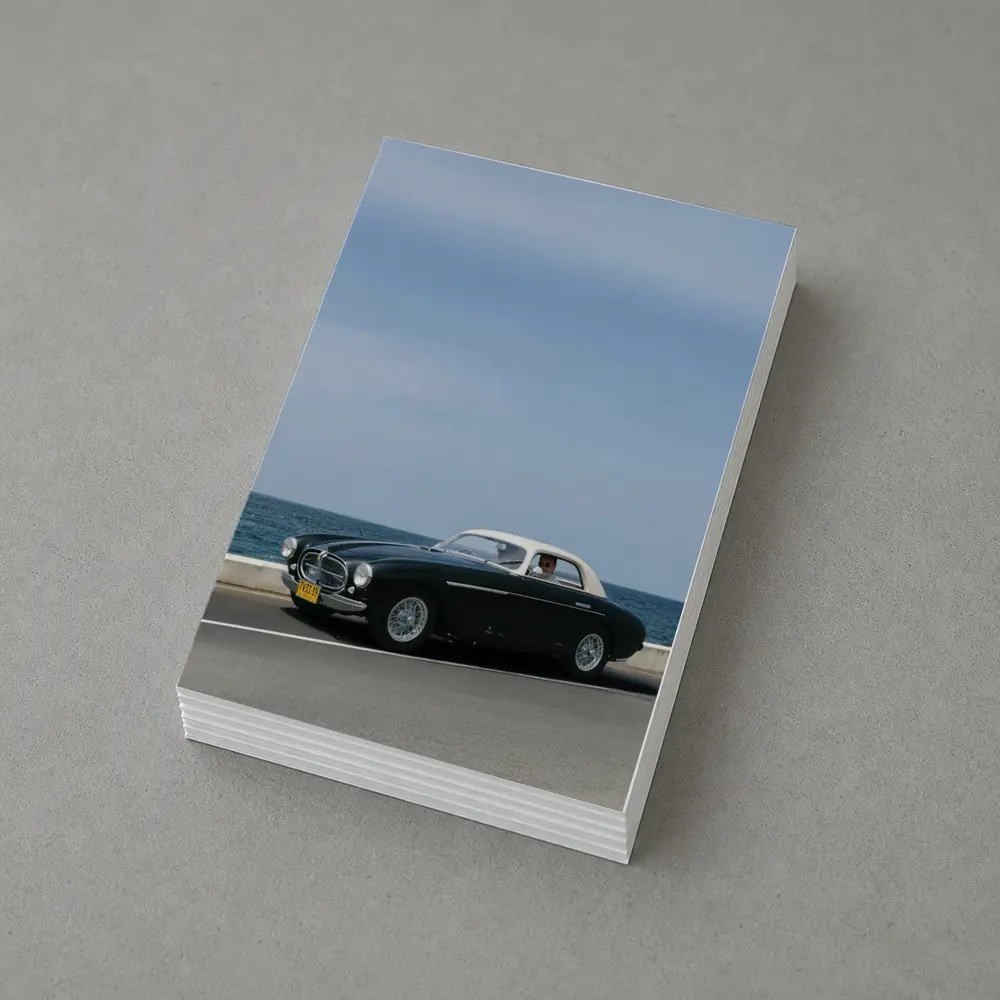Classic Ferrari Coupe Driving Along Coastal Road – Postcards