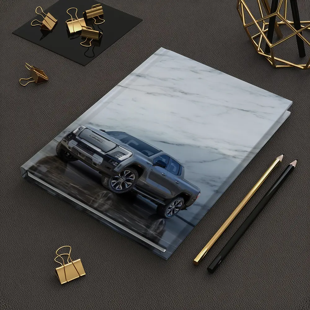 GMC Sierra EV Against Marble Wall – Notebooks