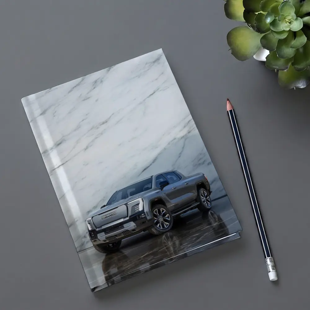 GMC Sierra EV Against Marble Wall – Notebooks