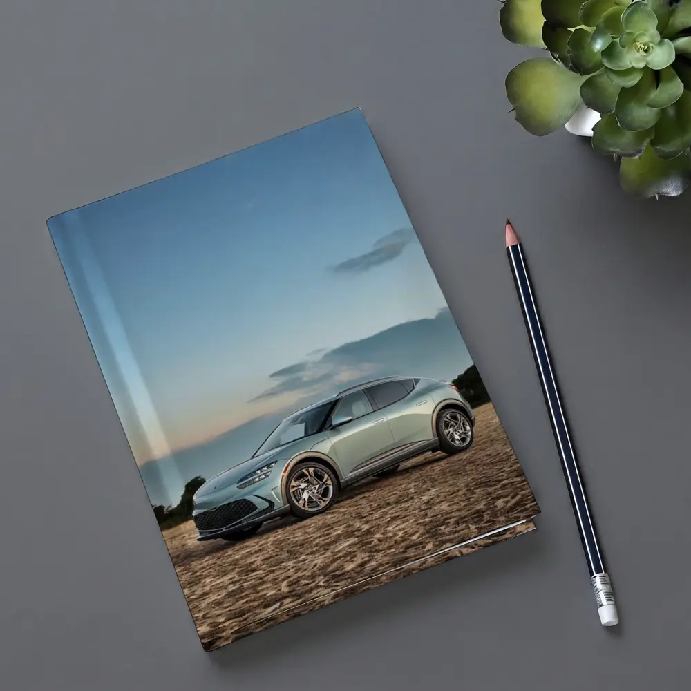 Genesis GV60 Parked on Sandy Beach – Notebooks