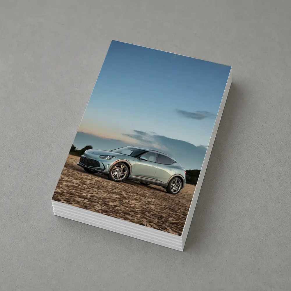 Genesis GV60 Parked on Sandy Beach – Postcards
