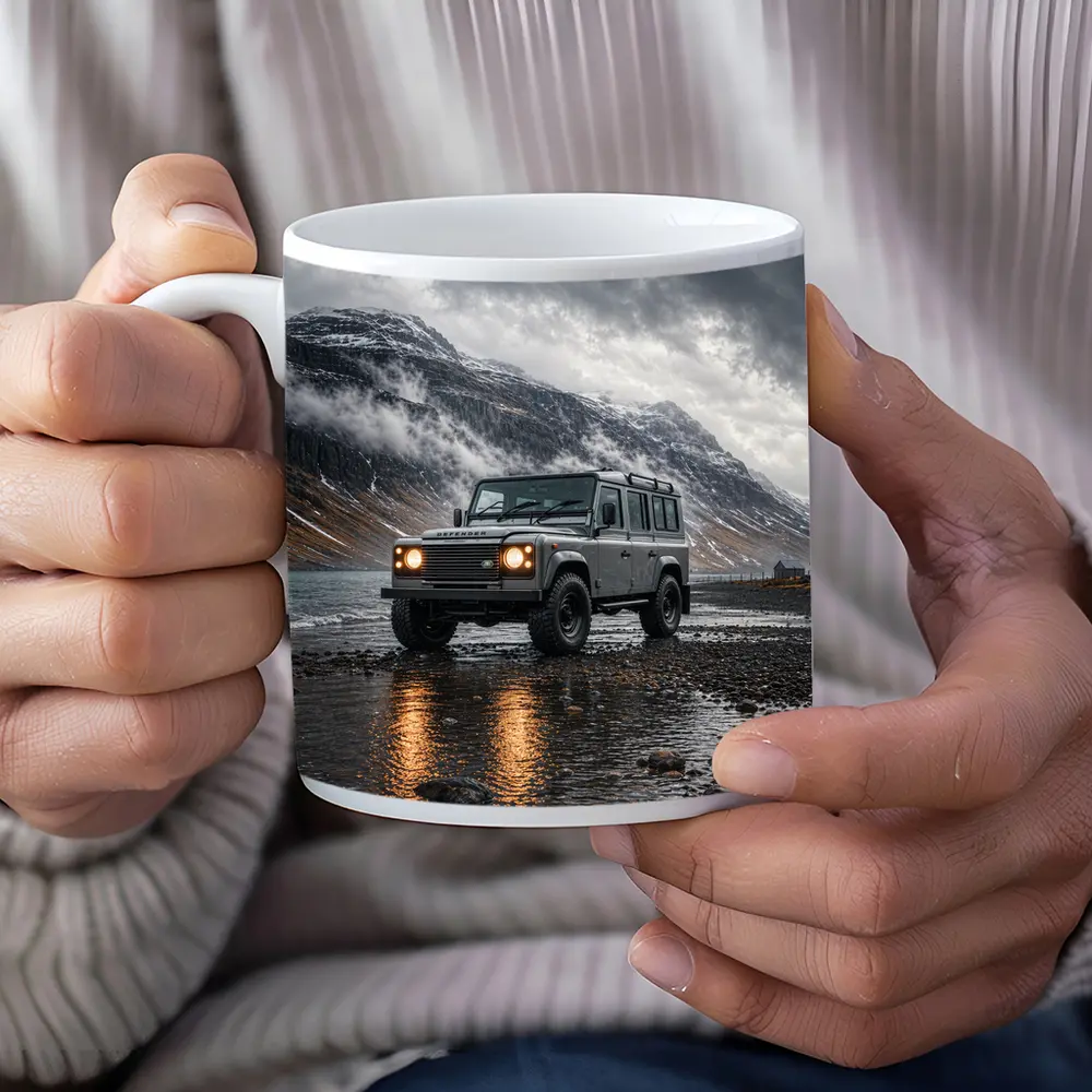 Land Rover Defender Parked On Rocky Shore – Mugs