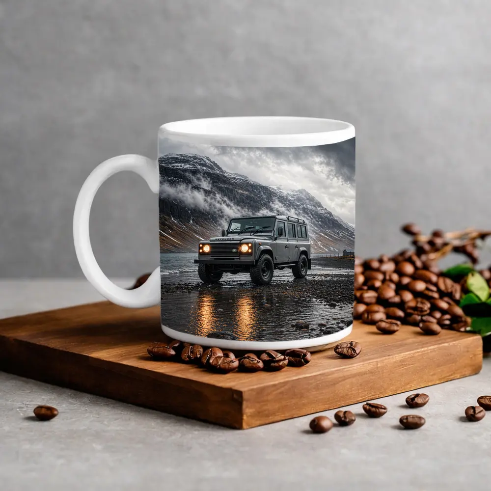 Land Rover Defender Parked On Rocky Shore – Mugs