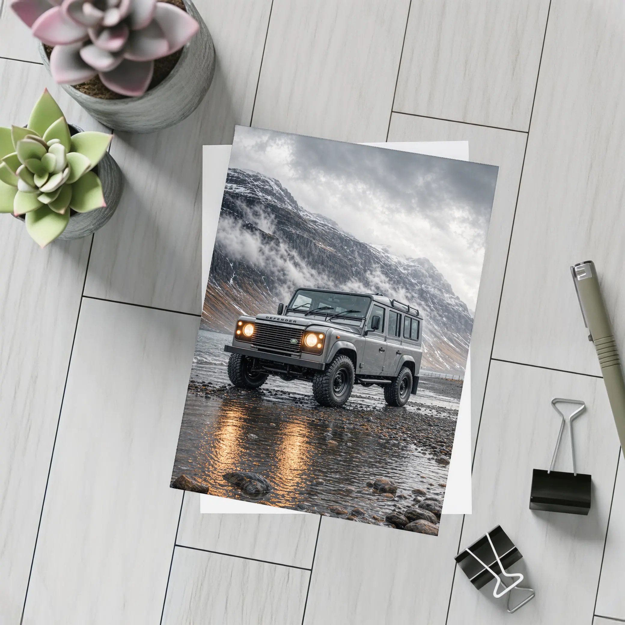 Land Rover Defender Parked On Rocky Shore – Postcards