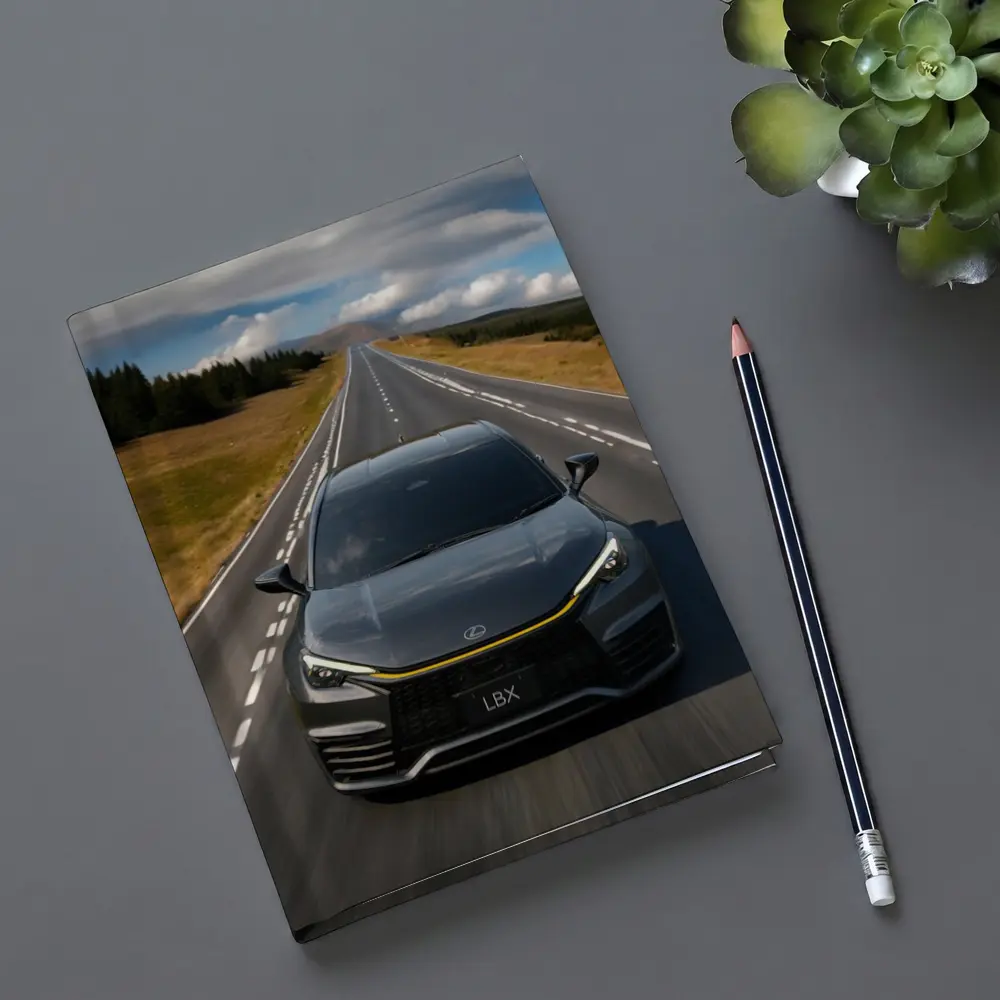 Lexus LBX Driving Open Road Dramatic Sky – Notebooks