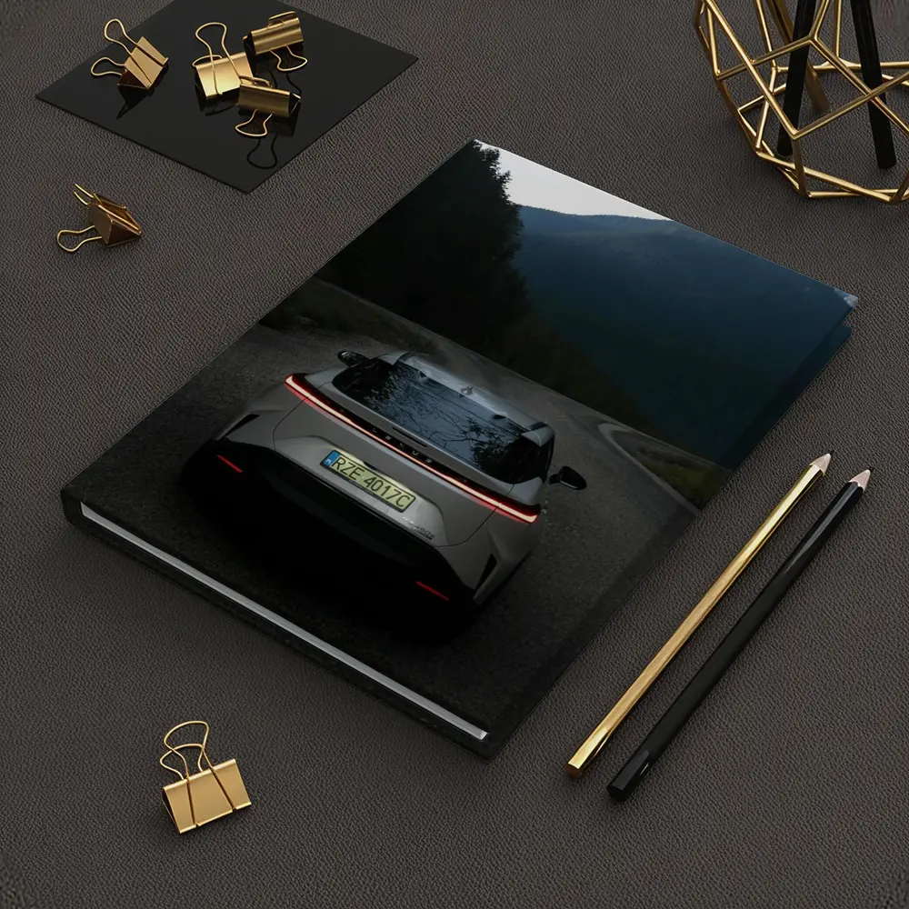 Lexus RZ On Mountain Road At Dusk – Notebooks