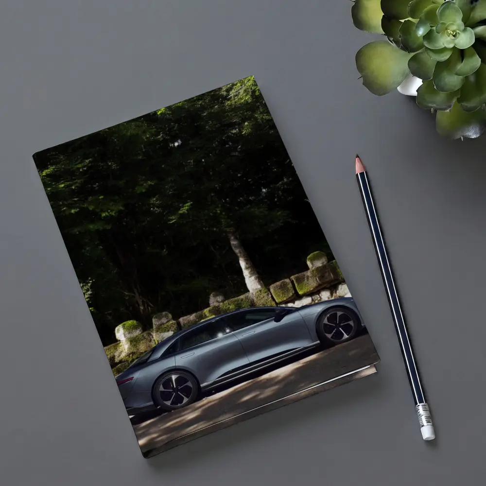 Lucid Air Pure Side Profile Forest Setting – Notebooks