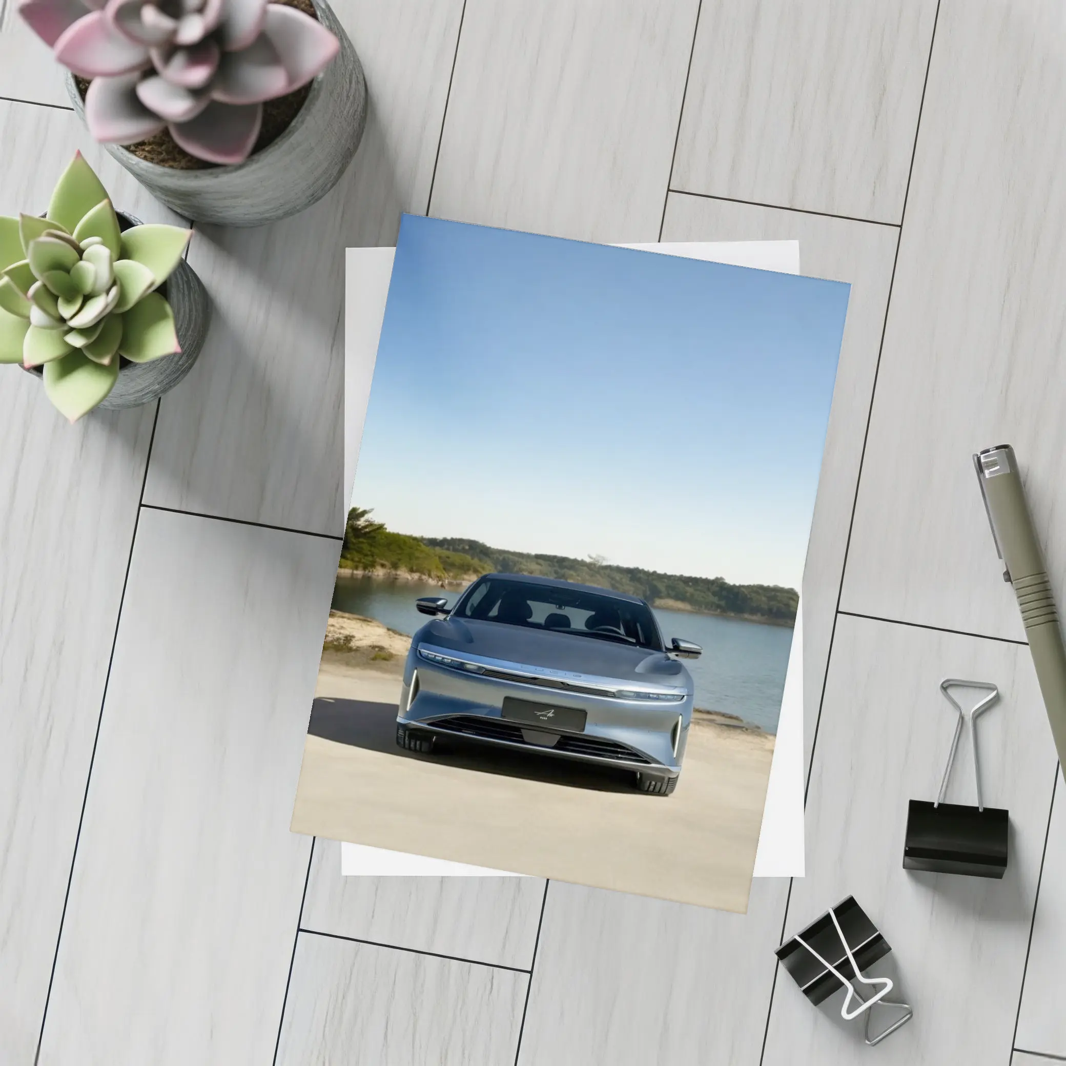 Lucid Air Pure Parked Near Calm Lake – Postcards
