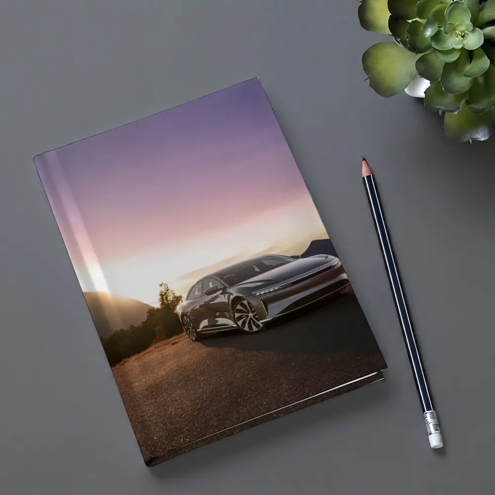 Lucid Air Parked Before Mountain Sunset – Notebooks