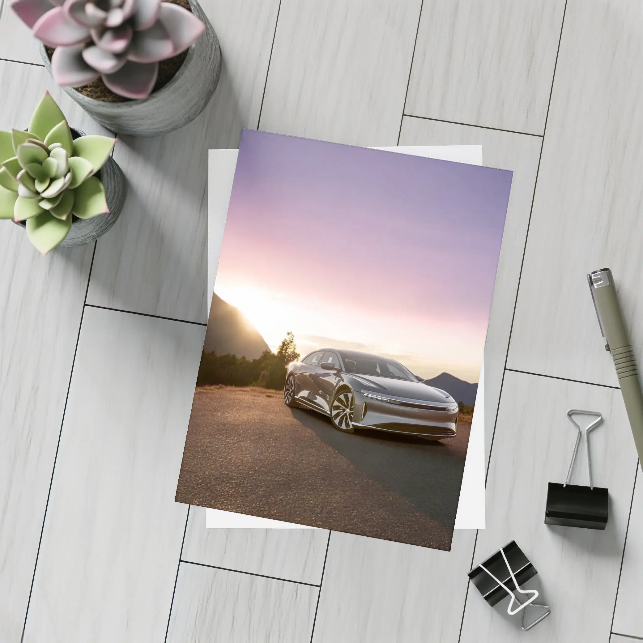 Lucid Air Parked Before Mountain Sunset – Postcards